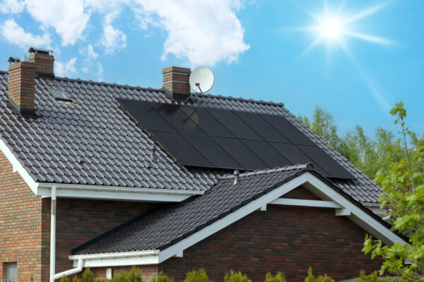 Attractive modern residence, dark solar technology, sunshine.