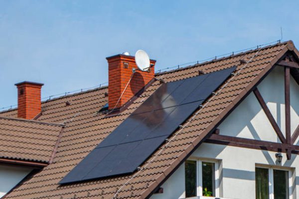 Historic house with modern solar panels on roof